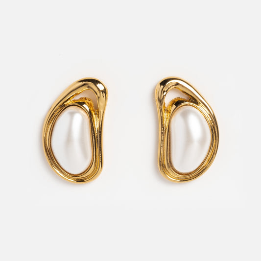 The Valia Earrings are gold plated with irregular oval shapes and white, pearl-like centers, shown on a plain white background.