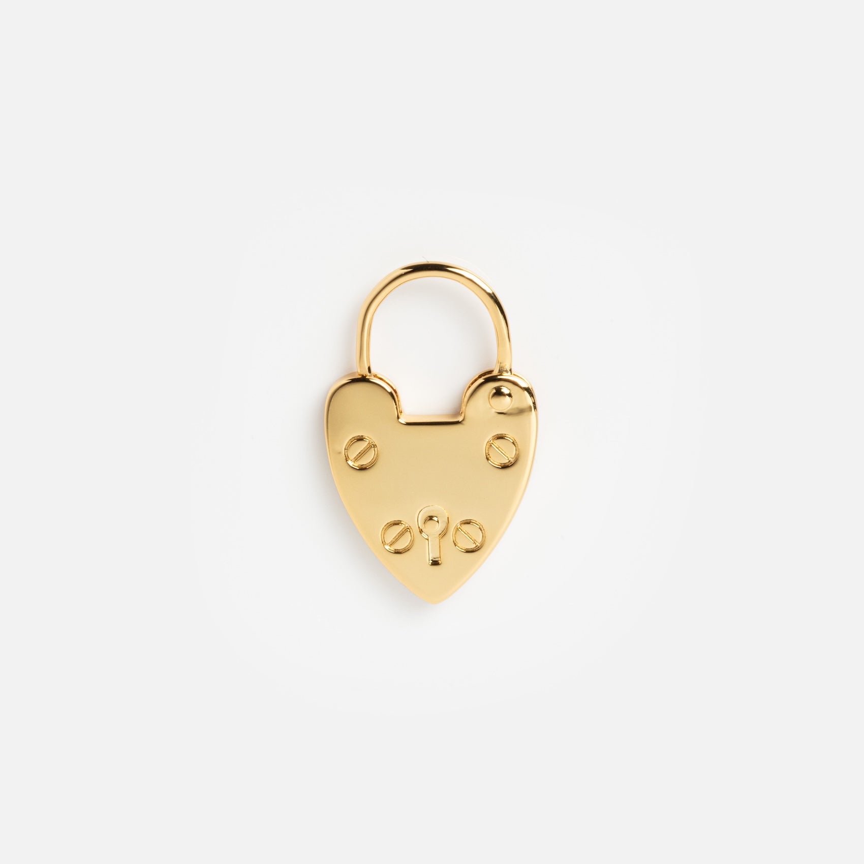 Charms by Mod + Jo: A shiny gold heart-shaped padlock with a rounded shackle and four screws, this piece is both jewelry and a good luck charm, beautifully displayed on a plain white background.
