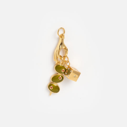 Charms by Mod + Jo features a gold keychain with a hand-shaped good luck charm holding a skewer of three green olives and a gold cube, accented with small red details, shown on a plain white background.