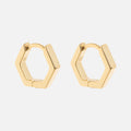 Ari Hoops: gold hexagonal hoop earrings showcased on a plain white background.