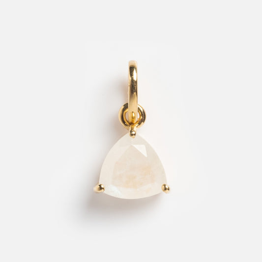 The Solid Gold Trillion Birthstone Charm showcases a triangular, faceted white gemstone in a three-prong setting, displayed against a plain white background.