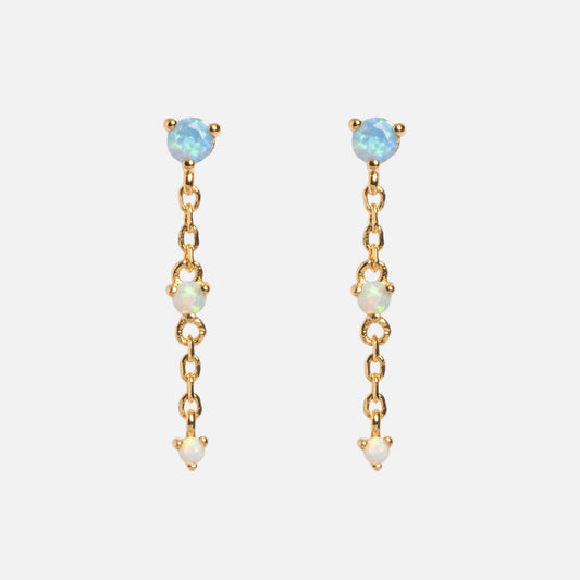 The Celebration Ombre Birthstone Drop Studs are 14k gold-plated chain drop earrings with three small, round opal gemstones on each earring, spaced along the chain and shown on a plain white background.