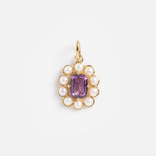 The Solid Gold 2026 June Capsule Vintage Inspired Alexandrite and Pearl Charm features an oval halo of white pearls around a central rectangular alexandrite, completed with a top loop for easy attachment to your favorite chain.