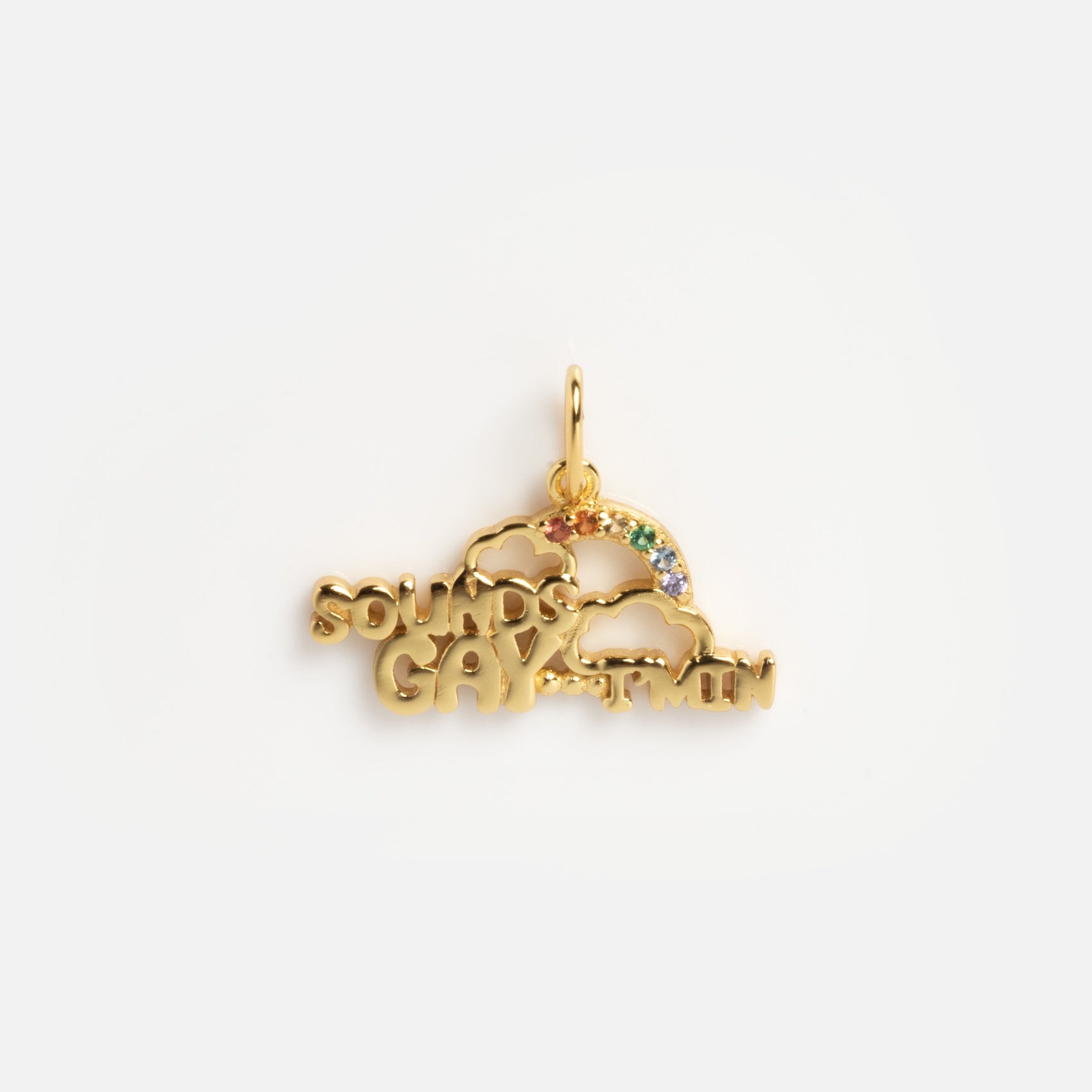 The Limited Edition PRIDE Month Charms are gold pendants with two clouds, a rainbow of colorful gems, and SOUNDS GAY I’M IN engraved in bold letters.