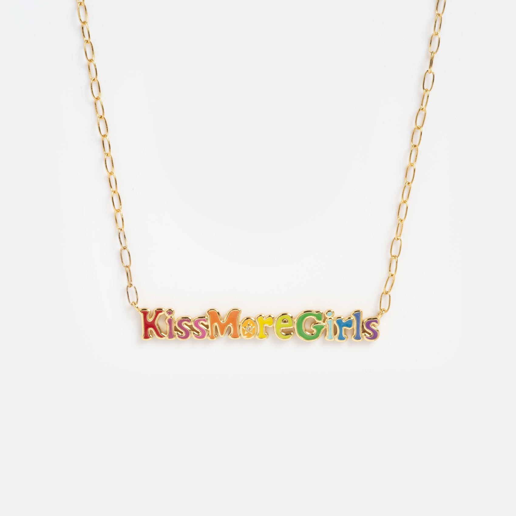The Kiss More Girls Necklace features a gold chain with colorful letters spelling "Kiss More Girls" in a playful font, displayed on a plain white background.