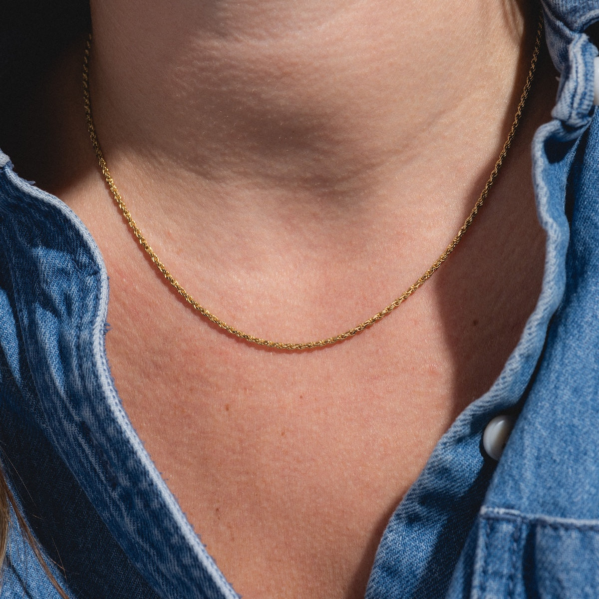 close up of rope chain worn on neck