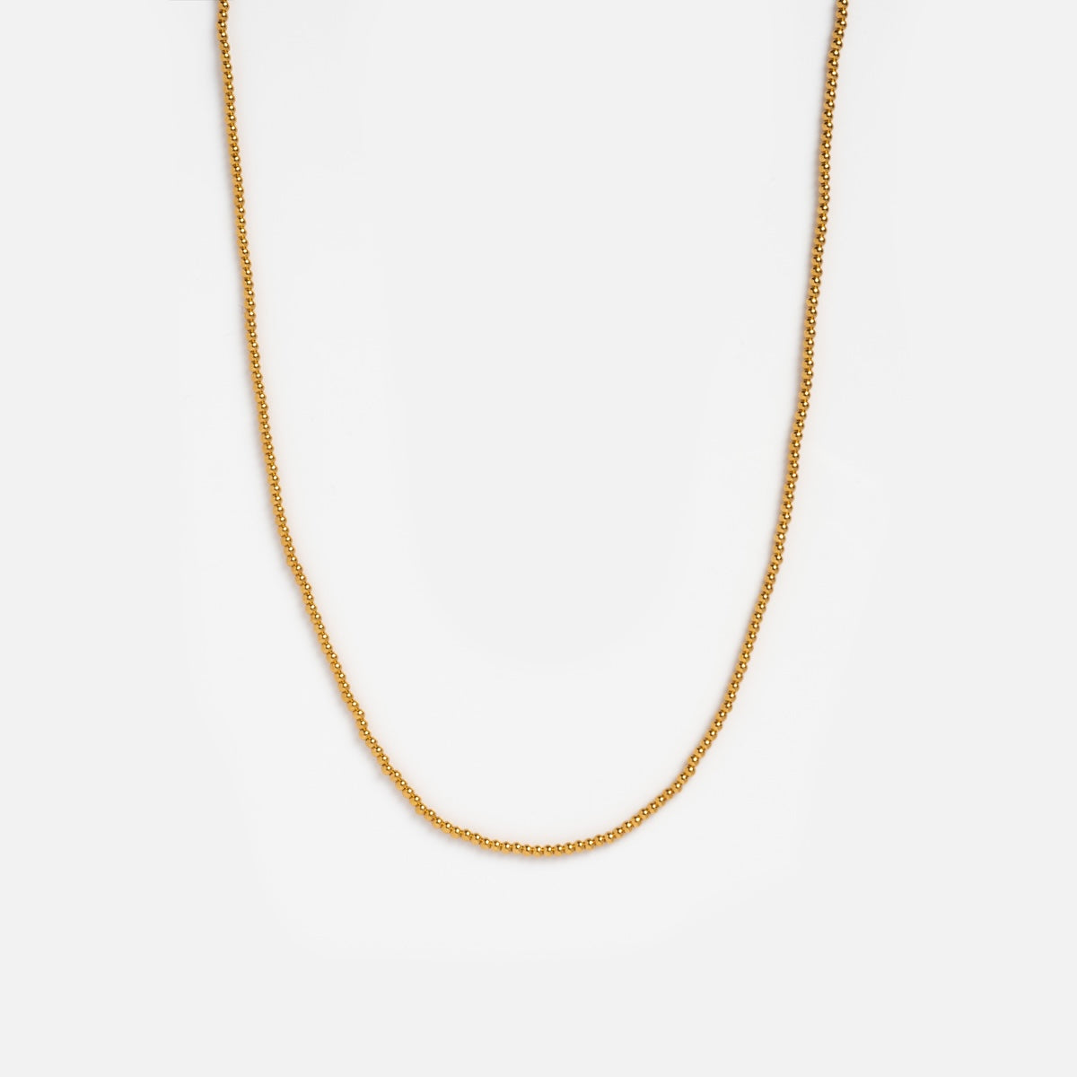 Vermeil beaded chain on white background