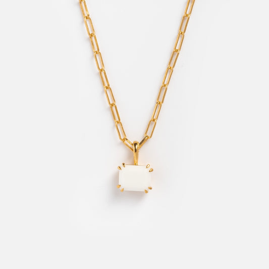 The Plated Birthstone Necklace October Sample features a yellow gold plated rectangular link chain with a white glass opal gemstone pendant in a gold prong setting, shown against a plain white background.