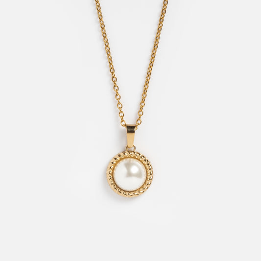The Paloma Necklace features a yellow gold-plated round pendant with a single freshwater pearl, encircled by a twisted gold rope design, shown on a plain white background.