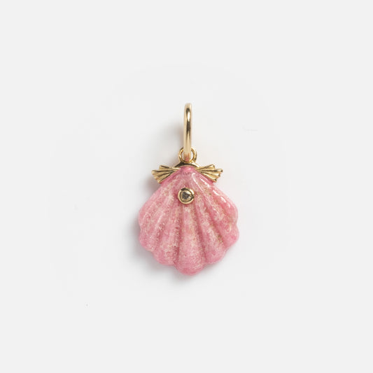 The Solid Gold Pink Seashell Charm Sample is a small, pink seashell-shaped pendant with a 9k solid yellow gold loop and trim, featuring a tiny white topaz gemstone at the center. Displayed on a plain white background.