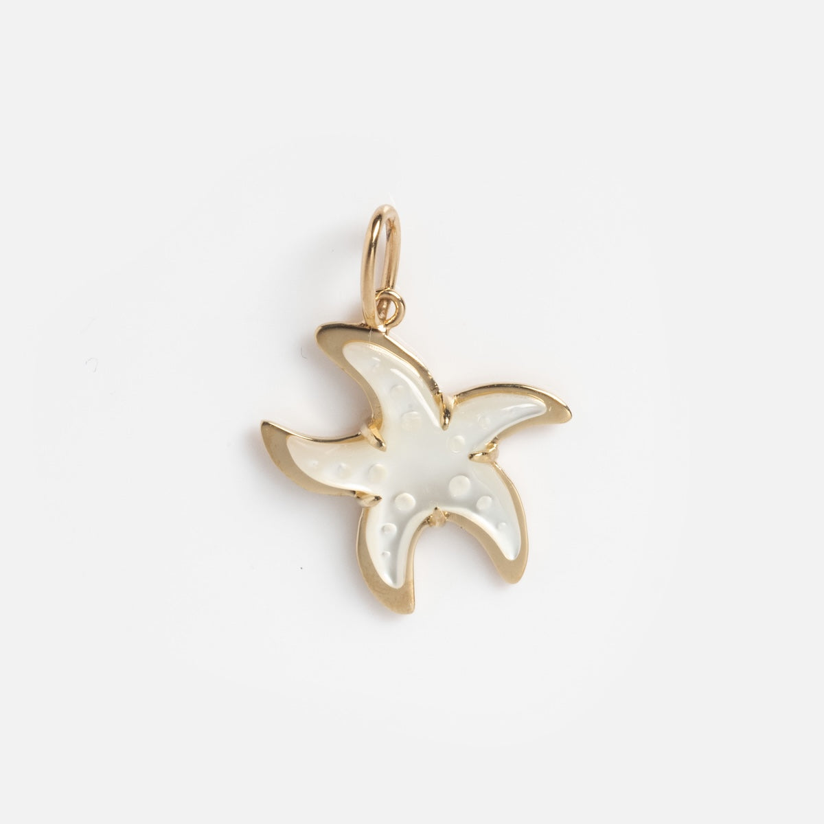 The Solid Gold Under The Sea Charm is a starfish-shaped gold pendant with a glossy white enamel center and delicate raised dots, evoking the sea’s beauty with its radiant glow against a simple white background.