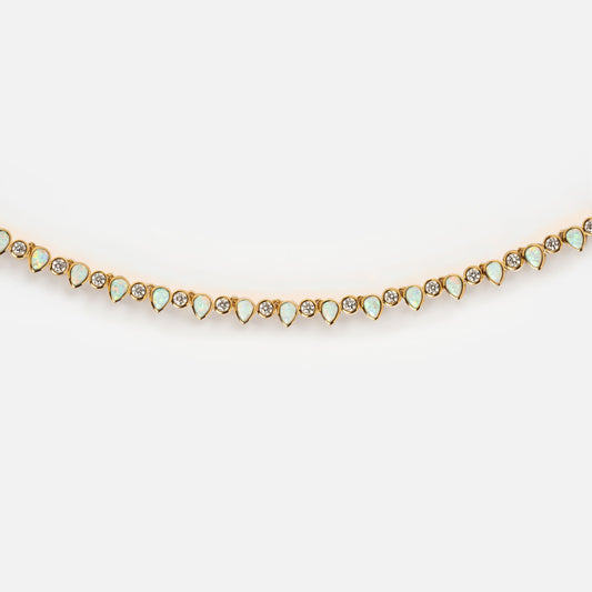 The Teardrop Tennis Necklace features sparkling small cubic zirconia stones set in elegant 14k gold for a stunning, timeless look.