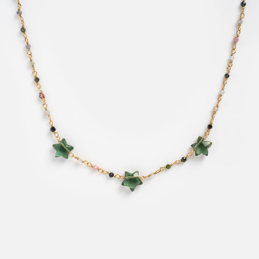 Multi-colored beaded gold necklace with three green tourmaline shaped stars on white background