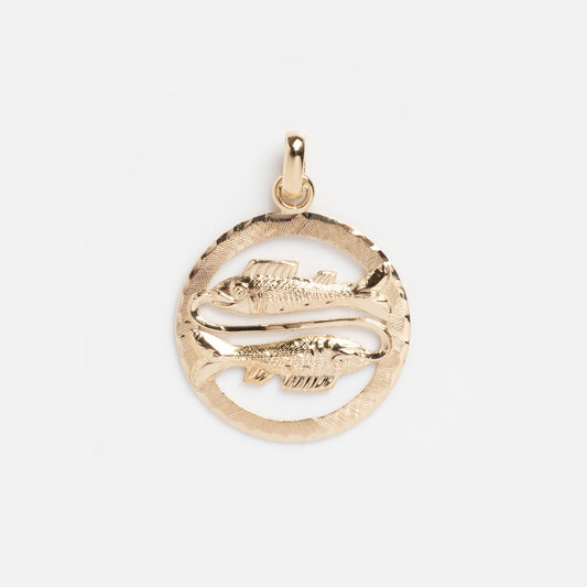 The Vintage 14k Openwork Pisces Charm is a gold pendant with two fish facing opposite directions in a textured circular frame, beautifully capturing the zodiac sign’s essence in timeless yellow gold.