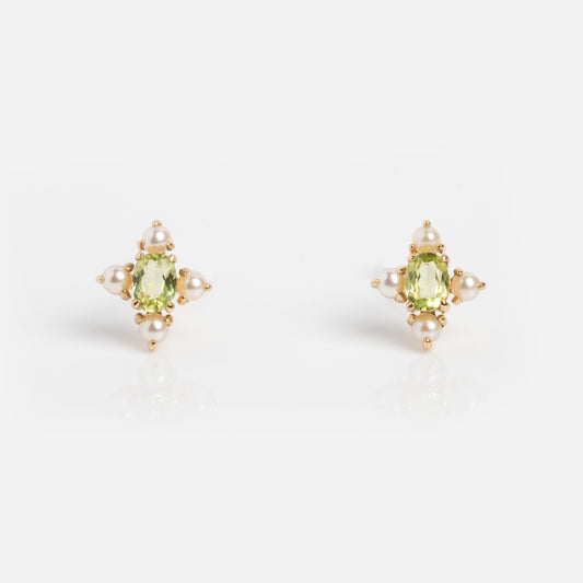 Peridot and pearl earrings on white 