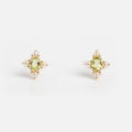 Peridot and pearl earrings on white 