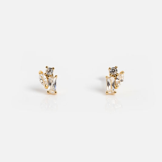 The Petite Pierre Studs are delicate yellow gold plated earrings with rectangular and round CZ gemstones, shown against a plain white background.