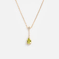 Peridot necklace on white background