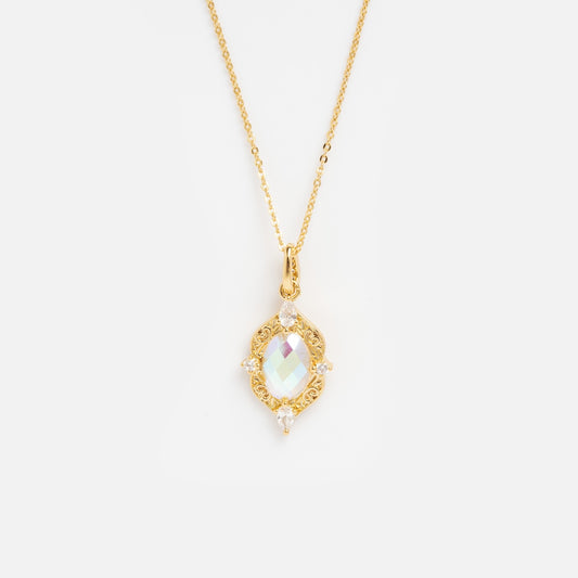 The Lady Luxe Angel Aura Quartz Pendant Necklace features a delicate 14k gold plated chain with a filigree oval pendant set with an iridescent gemstone and white accent stones, displayed on a plain white background.