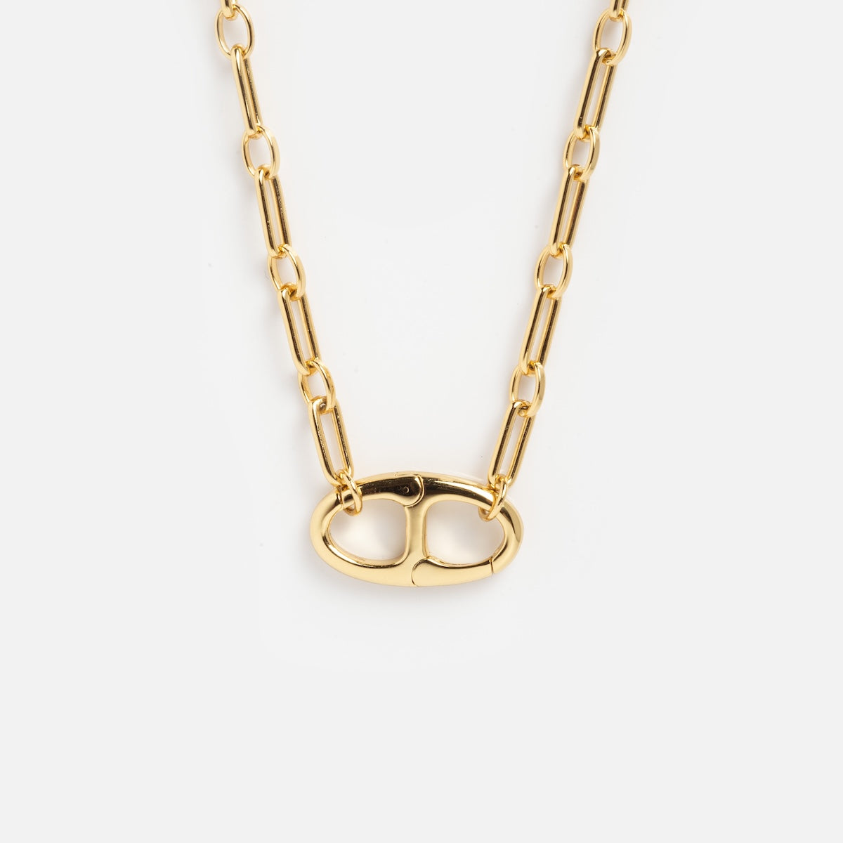 The Perfect Start Charm Holder Necklace features a gold-plated chain with elongated oval links and a large, horizontal oval charm clip clasp, shown on a plain white background.