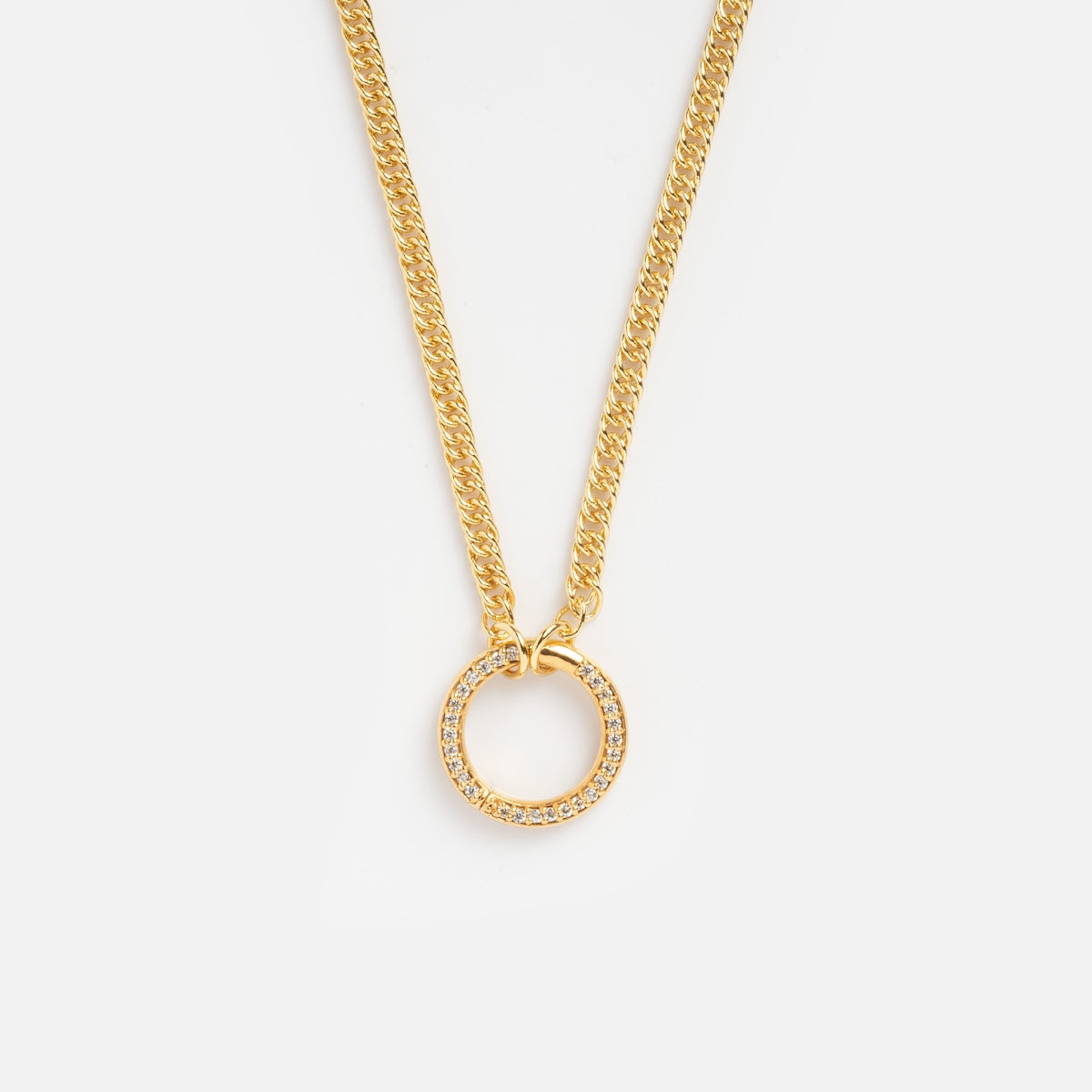 The Perfect Start Charm Holder Necklace features a gold-plated chain and a circular pendant with sparkling stones, shown on a white background—the ideal elegant accessory for holding your favorite charms.