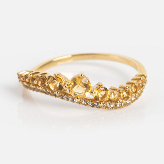 The Solid Gold Citrine and White Topaz Curved Ring Sample Size 7 features a row of citrine gemstones in a curved design with white topaz accents along the lower edge, displayed on a white background.