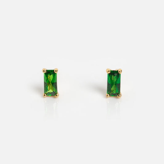 The Birthstone Baguette Studs May Sample are rectangular green gemstone stud earrings set in gold prongs, shown on a plain white background.