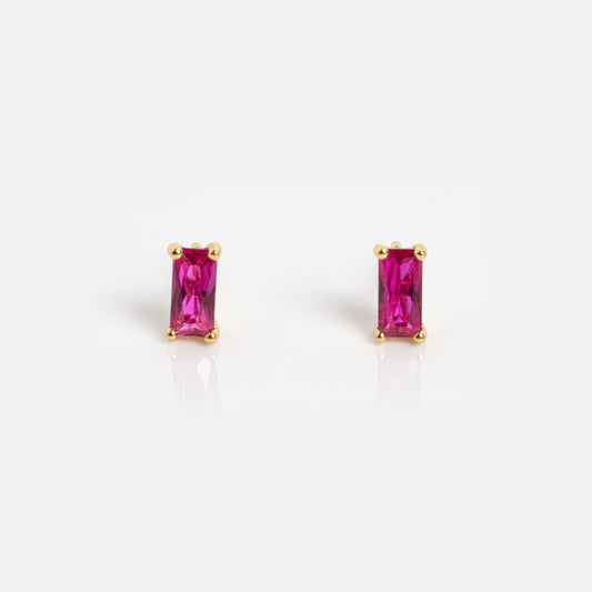 The Birthstone Baguette Studs July Sample features rectangular pink gemstone studs in gold prong settings, shown against a plain white background.