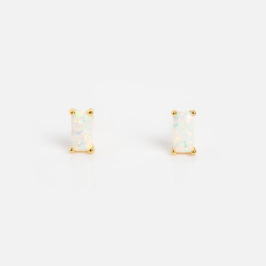 The Birthstone Baguette Studs October Sample are rectangular opal stud earrings set in gold prongs, shown on a plain white background.