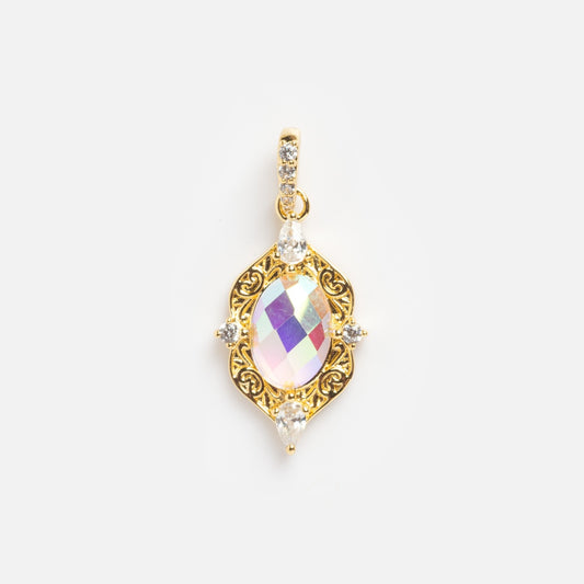 A Plated Vintage Inspired Opal Charm Sample with ornate gold detailing features a large oval iridescent opal center, surrounded by small clear stones, displayed on a plain white background.