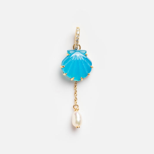 The Blue Shell Charm with Pearl Drop Sample is a gold earring featuring a blue seashell-shaped charm, a dangling white pearl, and small clear gemstones on the hoop, shown on a plain white background.