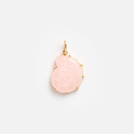 The Pink Spiral Shell Charm Sample is a gold pendant with a light pink, semi-translucent floral-shaped stone set in a delicate gold frame and features a small loop for attaching to a necklace.