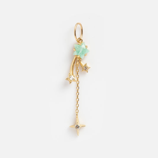 The Solid Gold Lucky Charm features a green gemstone, two small star charms, and a dangling gold chain ending with a star, displayed on a white background.