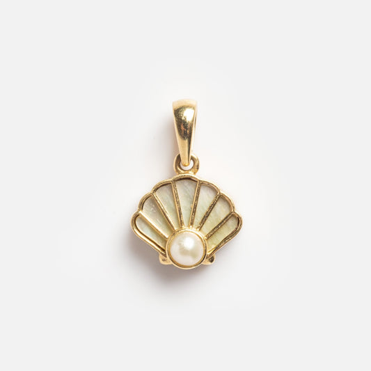 Solid Gold Pearl Seashell Charm Sample: a seashell-shaped gold pendant featuring white inlay and a small round pearl at the base, shown on a plain white background.