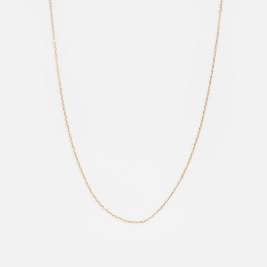 The Solid Gold Tiny Paperclip Chain Sample is a thin, delicate gold chain necklace shown against a simple white background.