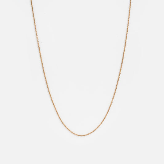 The Solid Gold Delicate Rolo Chain Sample is displayed against a plain white background.
