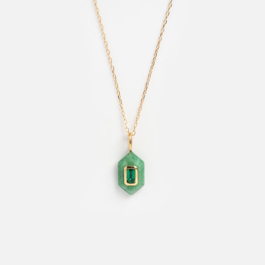 The Solid Gold Large Aura Necklace Green Sample features a gold chain with a hexagonal green pendant and a rectangular green gemstone set in a gold bezel, displayed on a plain white background.
