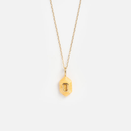 The Solid Gold Large Aura Necklace Yellow Sample features a delicate gold chain and a hexagonal pendant with a rectangular yellow gemstone, shown against a plain white background.
