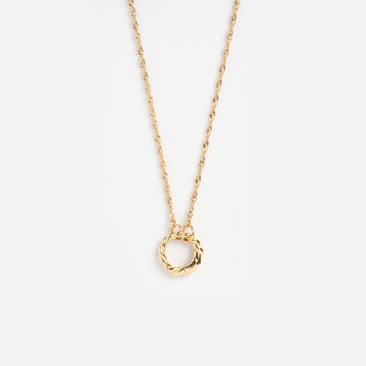 The Solid Gold Perfect Start Charm Holder Necklace is a delicate gold chain with a small, twisted circular pendant, displayed on a plain white background.