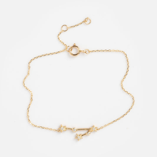 Solid Gold Zodiac Bracelet Pisces Sample: A delicate gold chain bracelet featuring a Pisces constellation design with small star accents and clear stones, secured with a spring ring clasp.