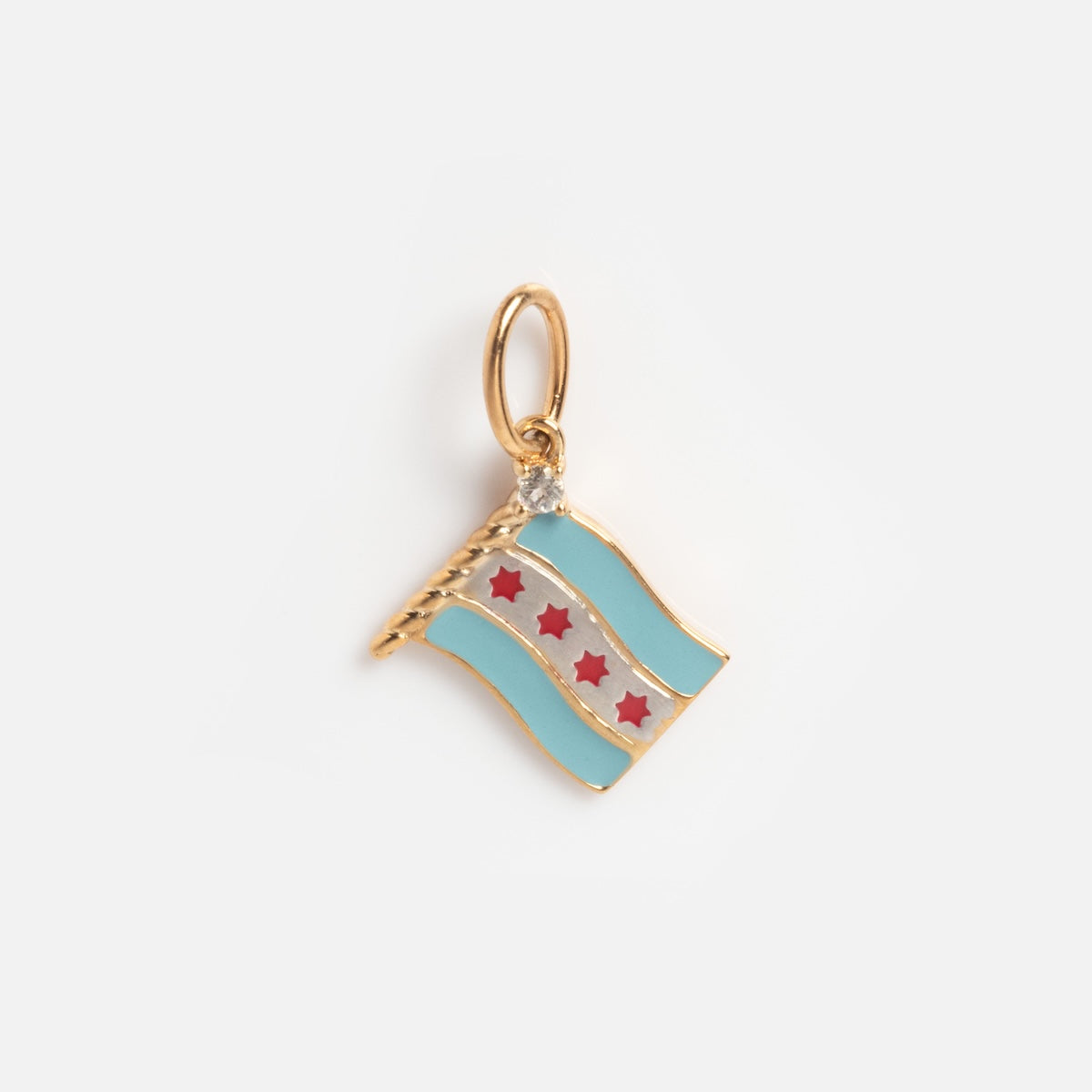 The Solid Gold Chicago Charm features a Chicago flag design with two light blue stripes, four red six-pointed stars in the center, and a small loop for attaching to jewelry.
