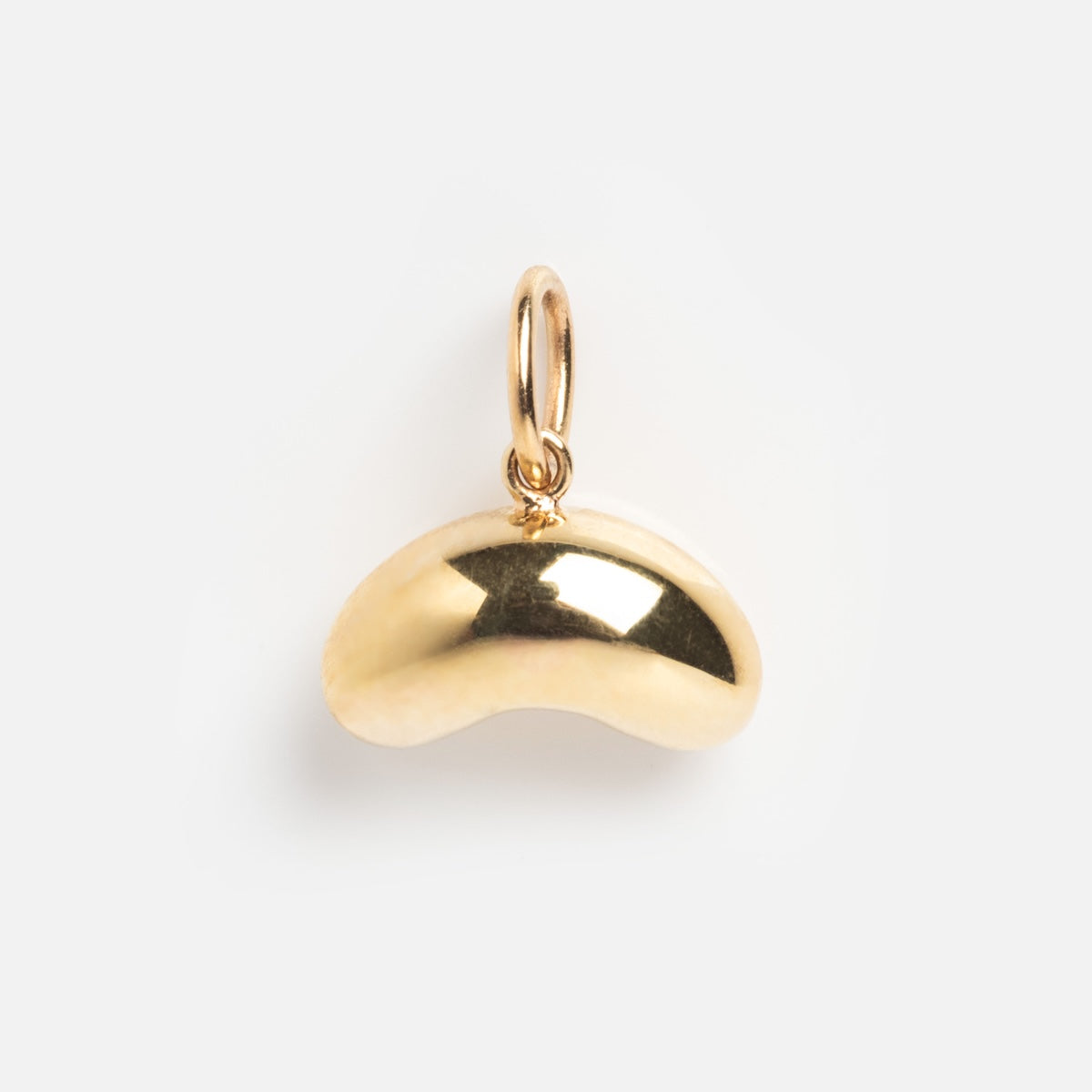 The Solid Gold Chicago Charm is a shiny, bean-shaped pendant featuring a small loop for attaching to a necklace or bracelet, displayed on a plain white background.