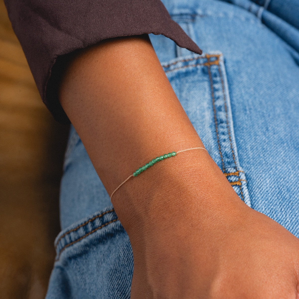 Dainty green onyx beaded wish bracelet worn on wrist