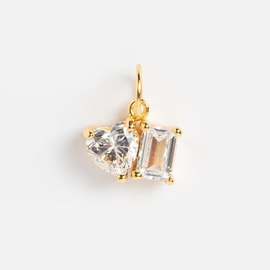The Charms by Jurate JLA features yellow gold plating with two simulated diamonds—one heart and one rectangular—both in gold prongs on a small loop. Add this sparkling charm to your collection for a touch of elegance.