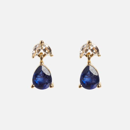 The Solid Gold 2025 September Capsule Classic Blue Sapphire Stud Earrings feature teardrop blue sapphires below two marquise-cut white topaz stones, all set in 9k yellow gold against a plain white background.