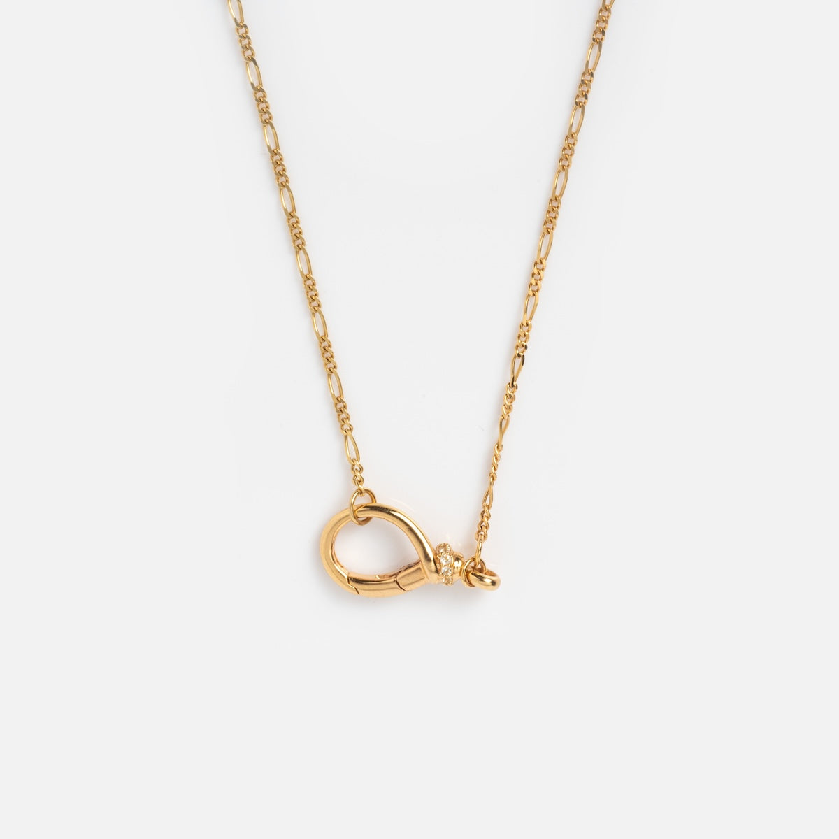The Solid Gold Figaro Charm Holder Necklace features a delicate gold chain and an oversized lobster clasp pendant, showcased on a plain white background.