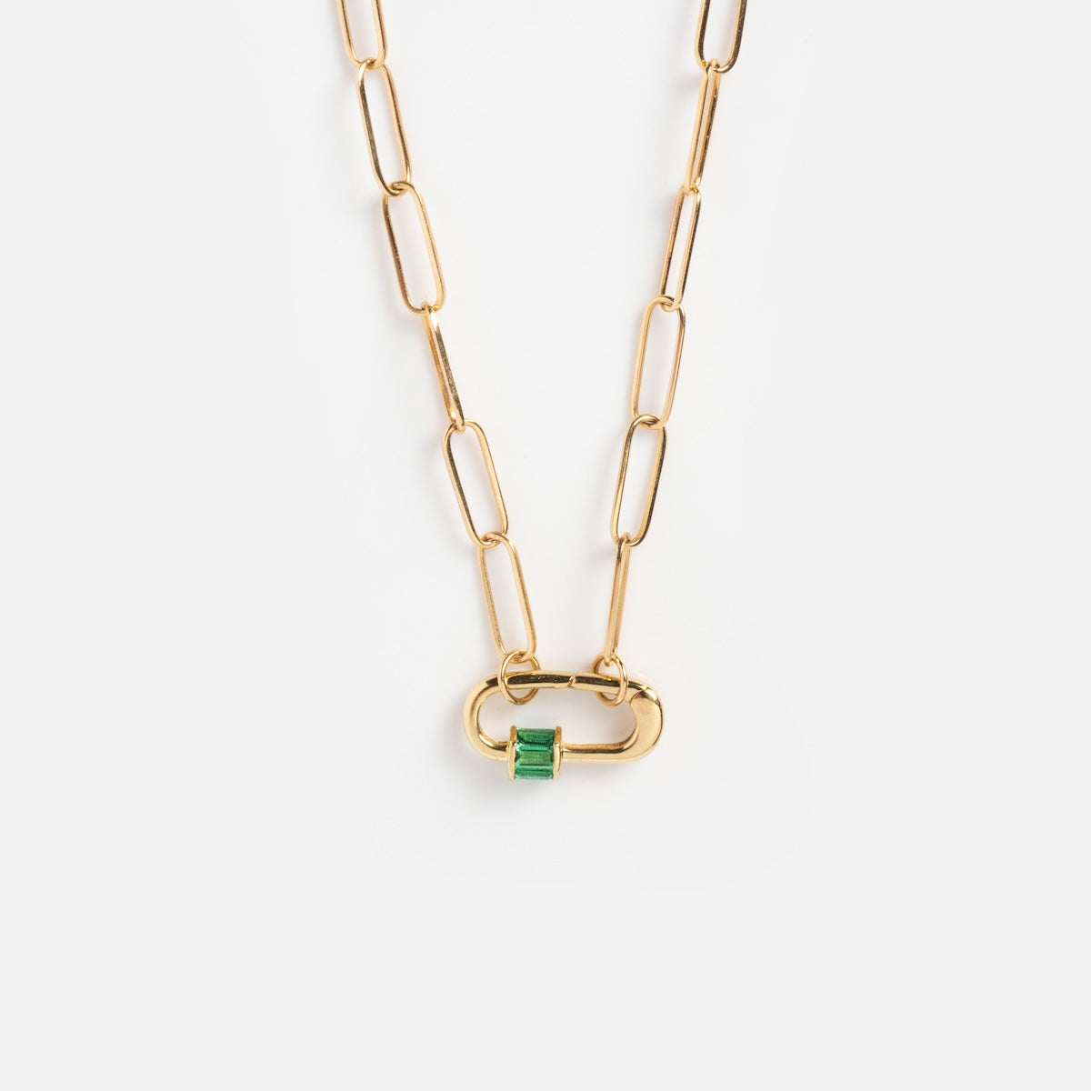 The Solid Gold Perfect Start Charm Holder Necklace features elongated oval links and a rectangular green gemstone in a gold clasp, showcased against a plain white background.