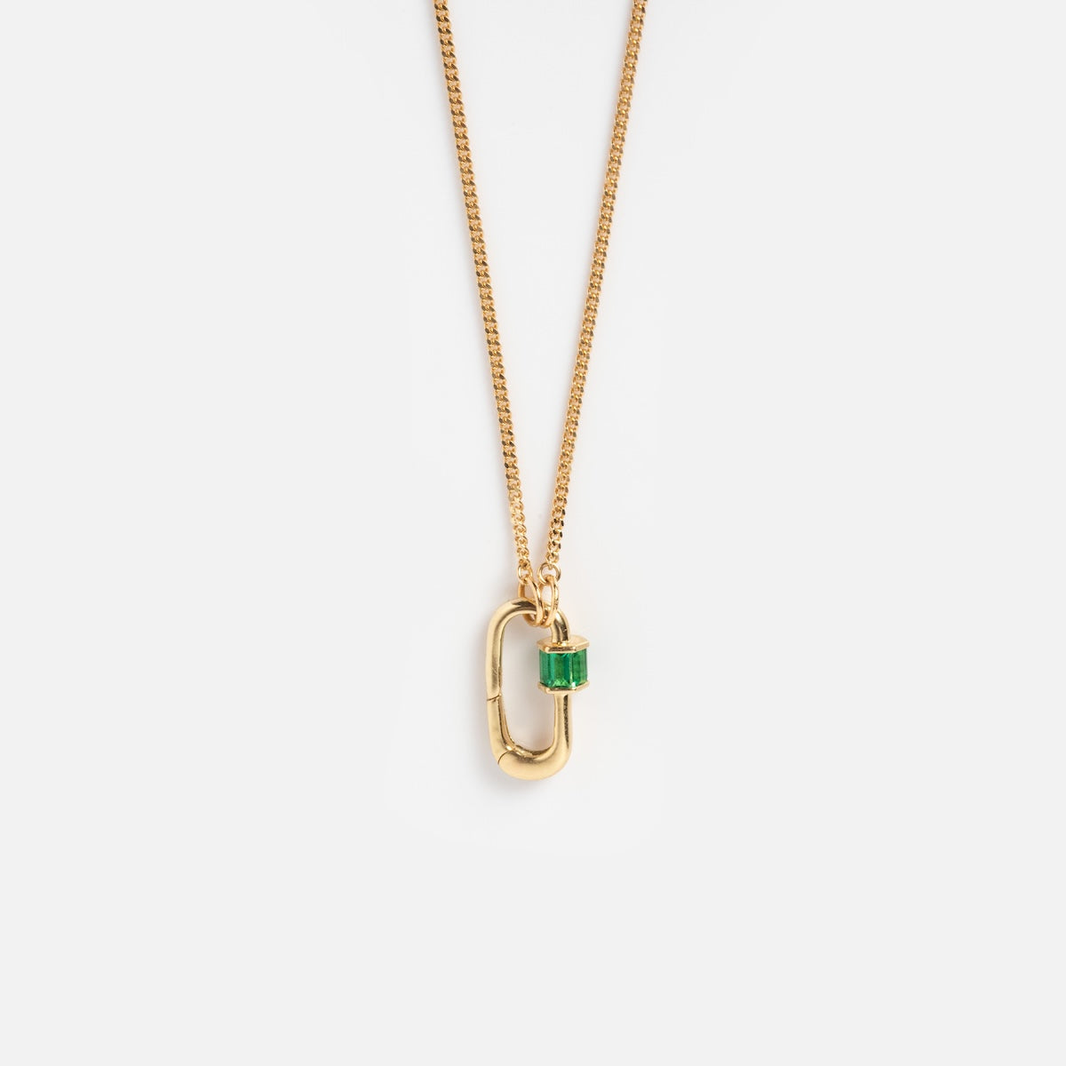 The Solid Gold Perfect Start Charm Holder Necklace features a gold chain with an oval-shaped pendant and a small green rectangular charm, displayed against a plain white background.