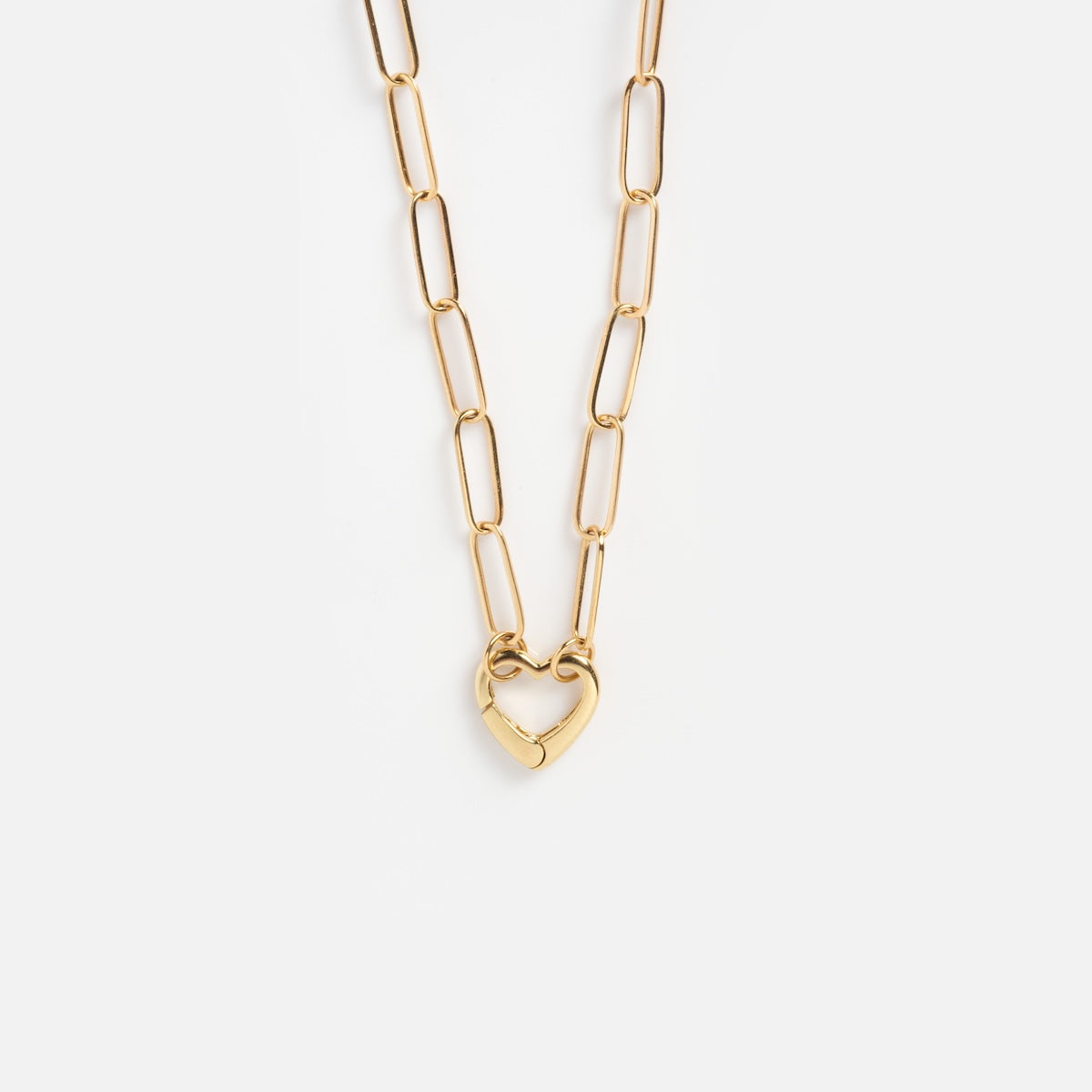 The Solid Gold Perfect Start Charm Holder Necklace features large rectangular links and a heart-shaped clasp, showcased on a plain white background.