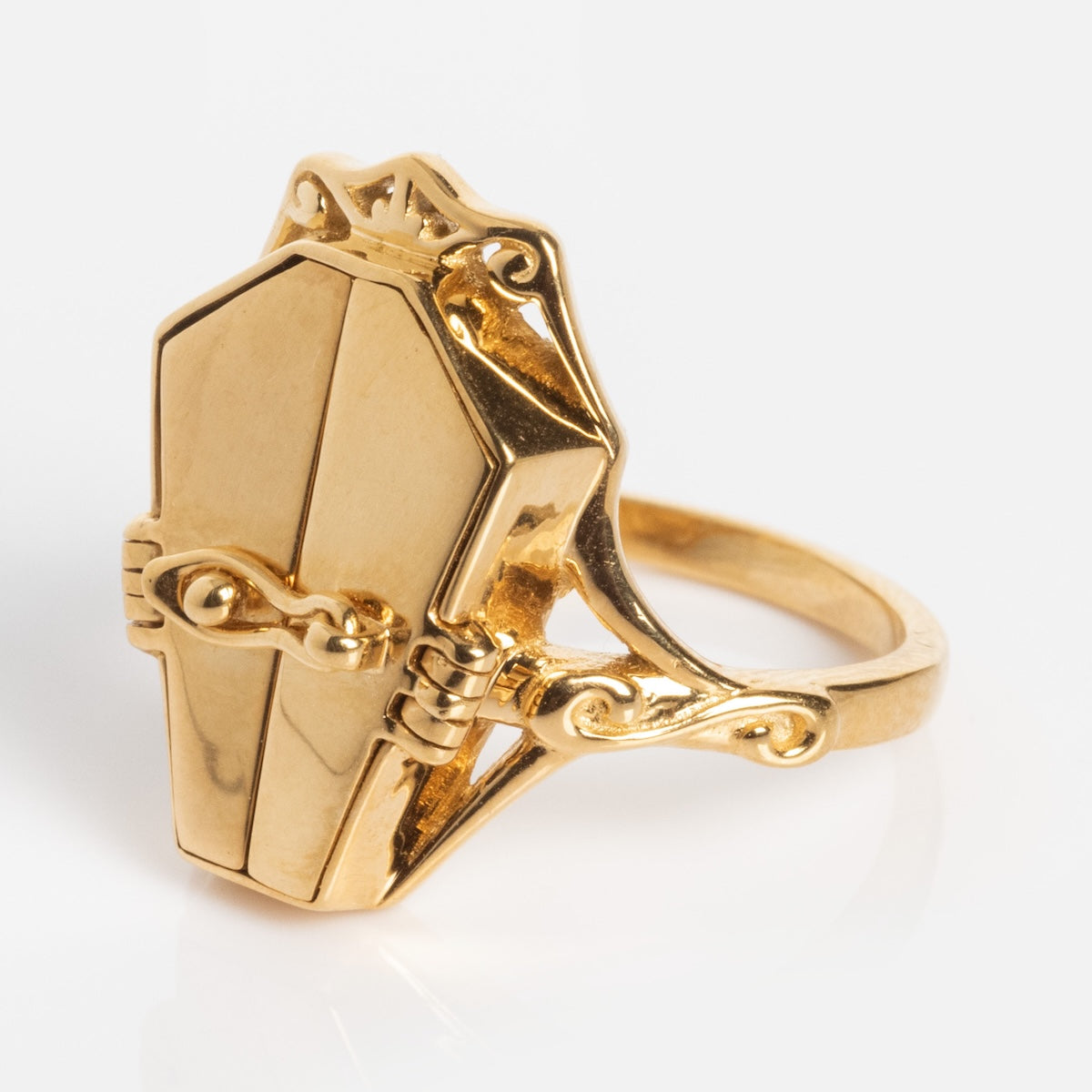 The Limited Edition Til Death Do Us Part Poison Ring features a detailed, miniature coffin-shaped design on an ornate gold band, displayed against a plain white background.